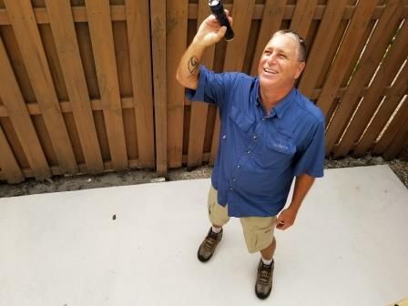 Denny Dean of Island Home inspectors checking the soffits