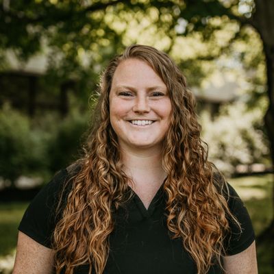 Chiropractor in Concord Massachusetts, Chiropractor Dr. Nikki Goodwin smiling at camera outside