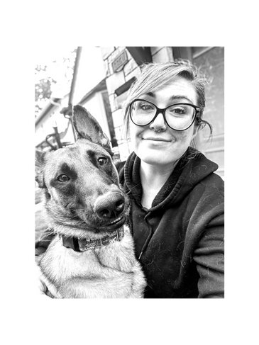 Fem sitting with her Belgian Malinois dog, Oakley.