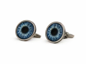 Cufflinks designed like blue human irises.