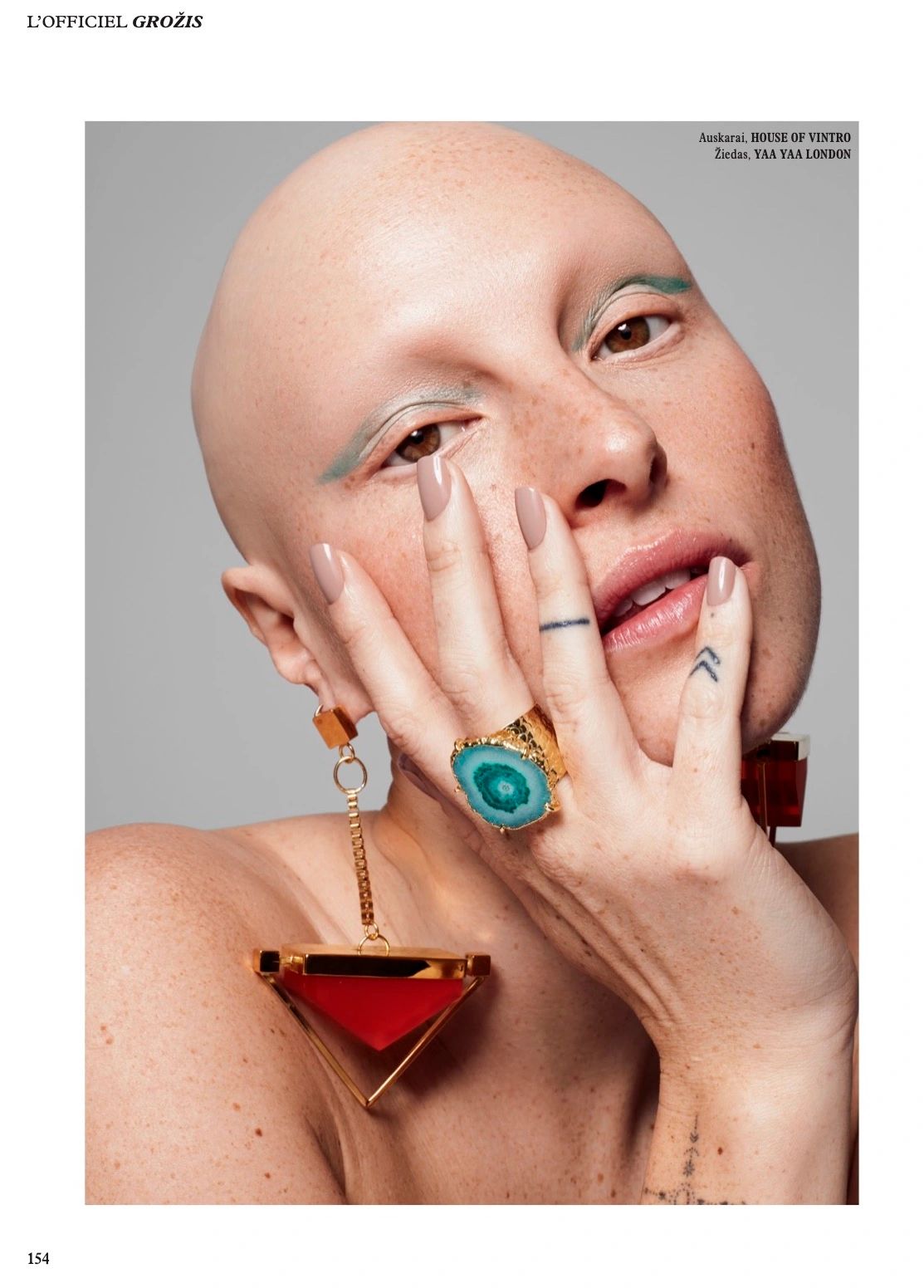 YAA YAA LONDON as featured in L'OFFICIEL. The model wears our 'SOLAR POWER' Ring in Green.