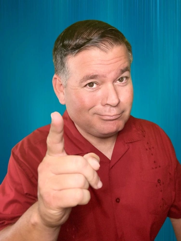 Hypnotist Joseph Roberts smirking as he is ready to hypnotize you.