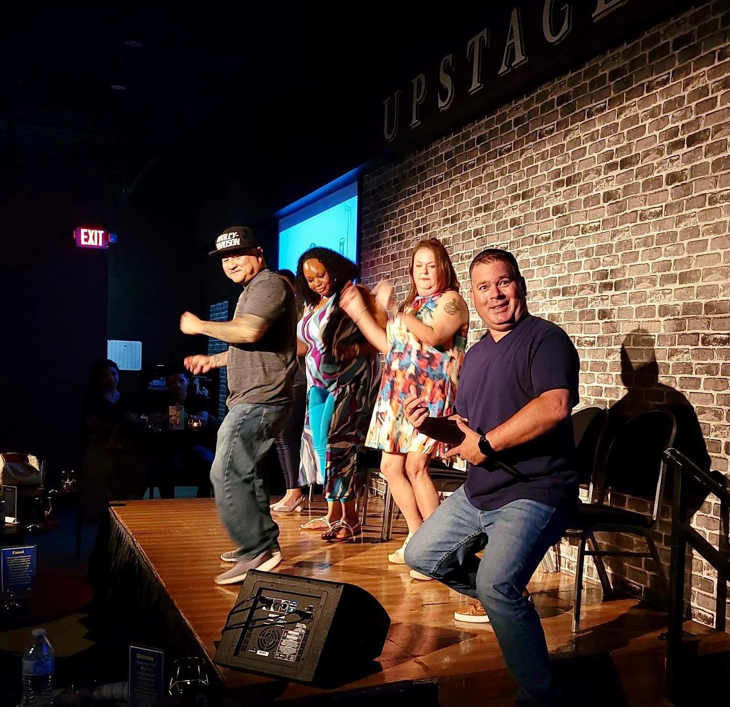 Hypnotized volunteers during a comedy hypnosis show with Hypnotist Joseph Roberts.