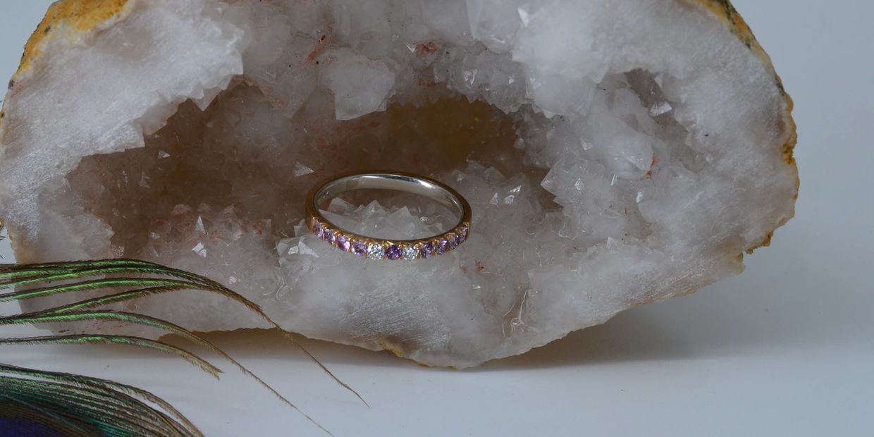 French cut fish tail setting with purple spinels on 14k gold ring with silver lining inside of ring.