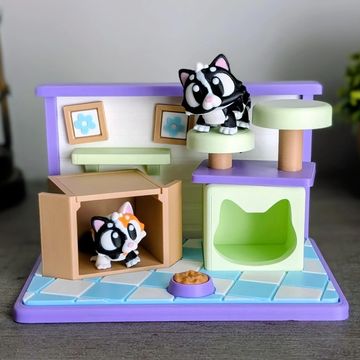 3D printed cat habitat playset with articulated cats and layered miniature details.