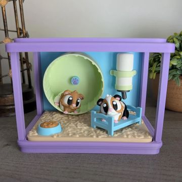 Miniature guinea pig habitat desk pet with movable wheel and cozy small animal decor.