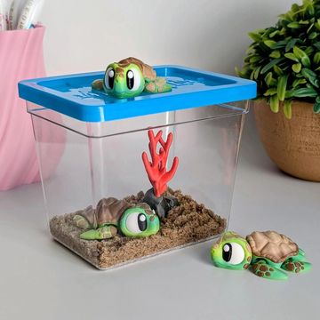 Articulated sea turtle desk pet with ocean-inspired habitat and coastal themed decor.