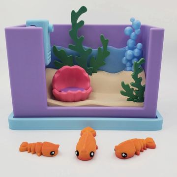 Shrimp tank desk pet with colorful underwater details and aquatic miniature habitat decor.