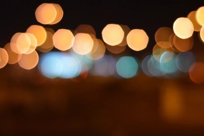 Blurred city lights creating a colorful bokeh effect at night.