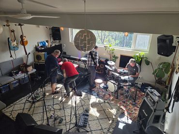 Eddie, Mike, Steve & Thomas setting up gear in the studio