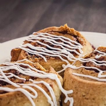 Iced cinnamon rolls on a plate