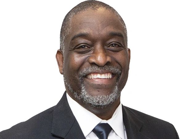 Smiling man in a suit and tie.