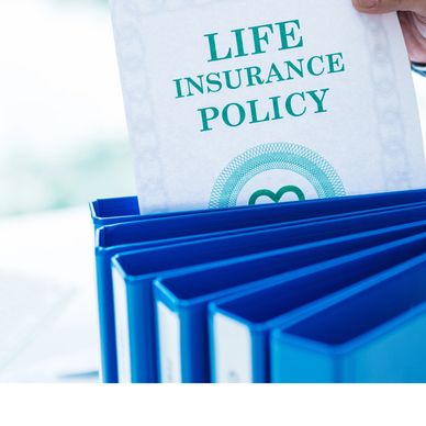 Life insurance policy document with blue binders.