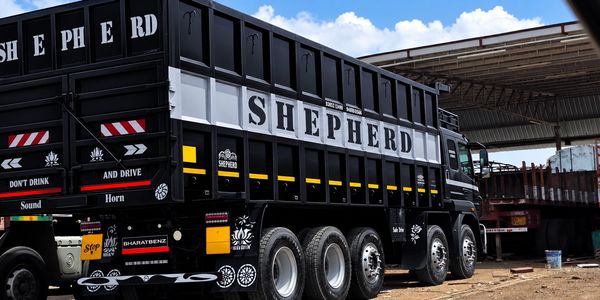 Black truck with 'SHEPHERD' branding on the side.