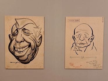 Two caricature sketches of men's faces on beige paper.