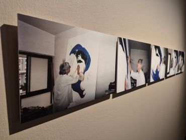 A series of photos showing a person painting a wall mural indoors.