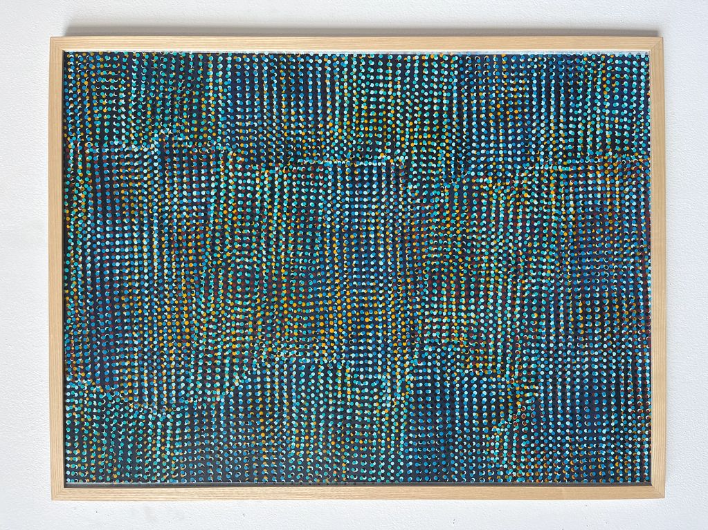 Abstract dot painting with blue, turquoise, and orange hues in a wooden frame.