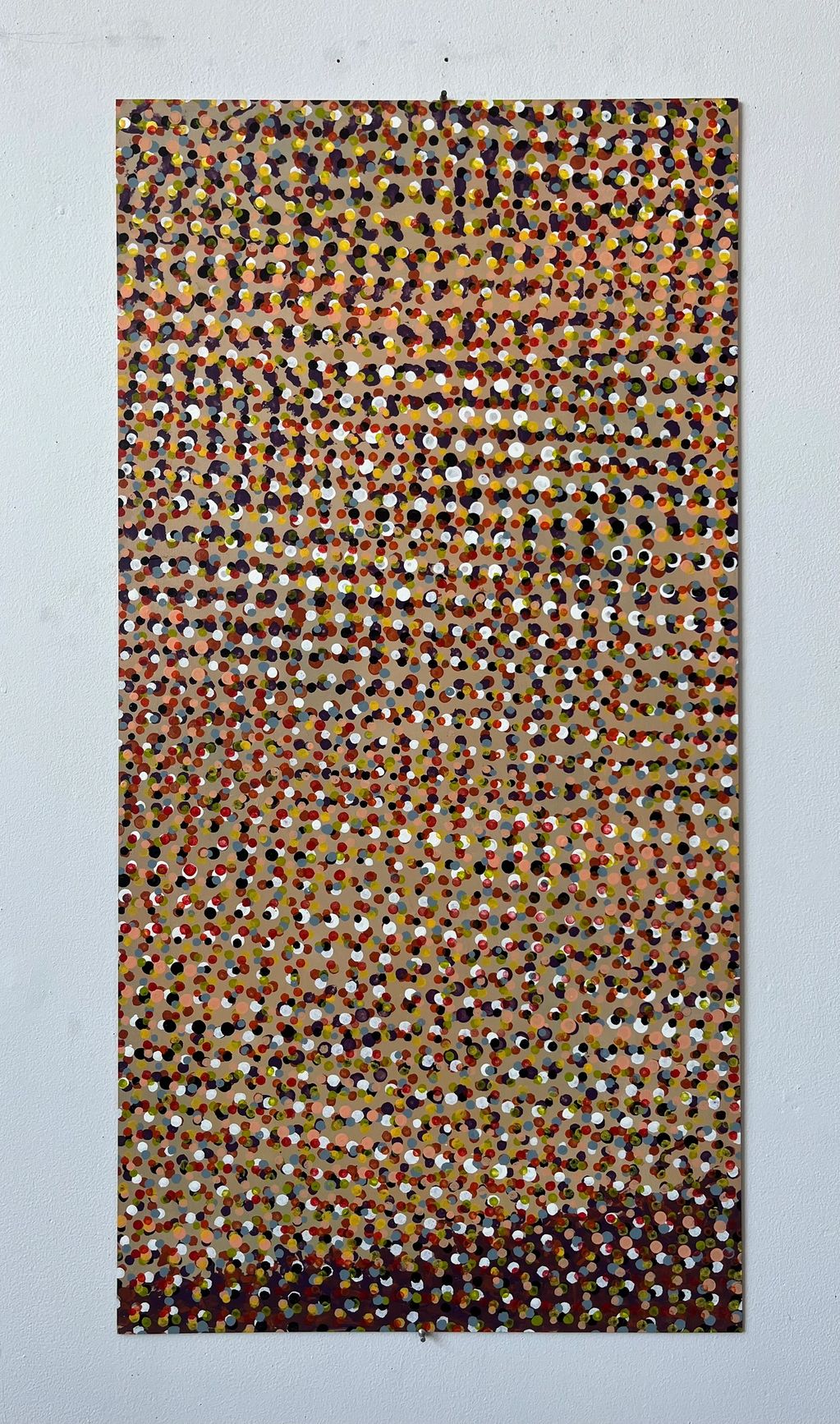 A colorful abstract painting with numerous small dots on a beige background.