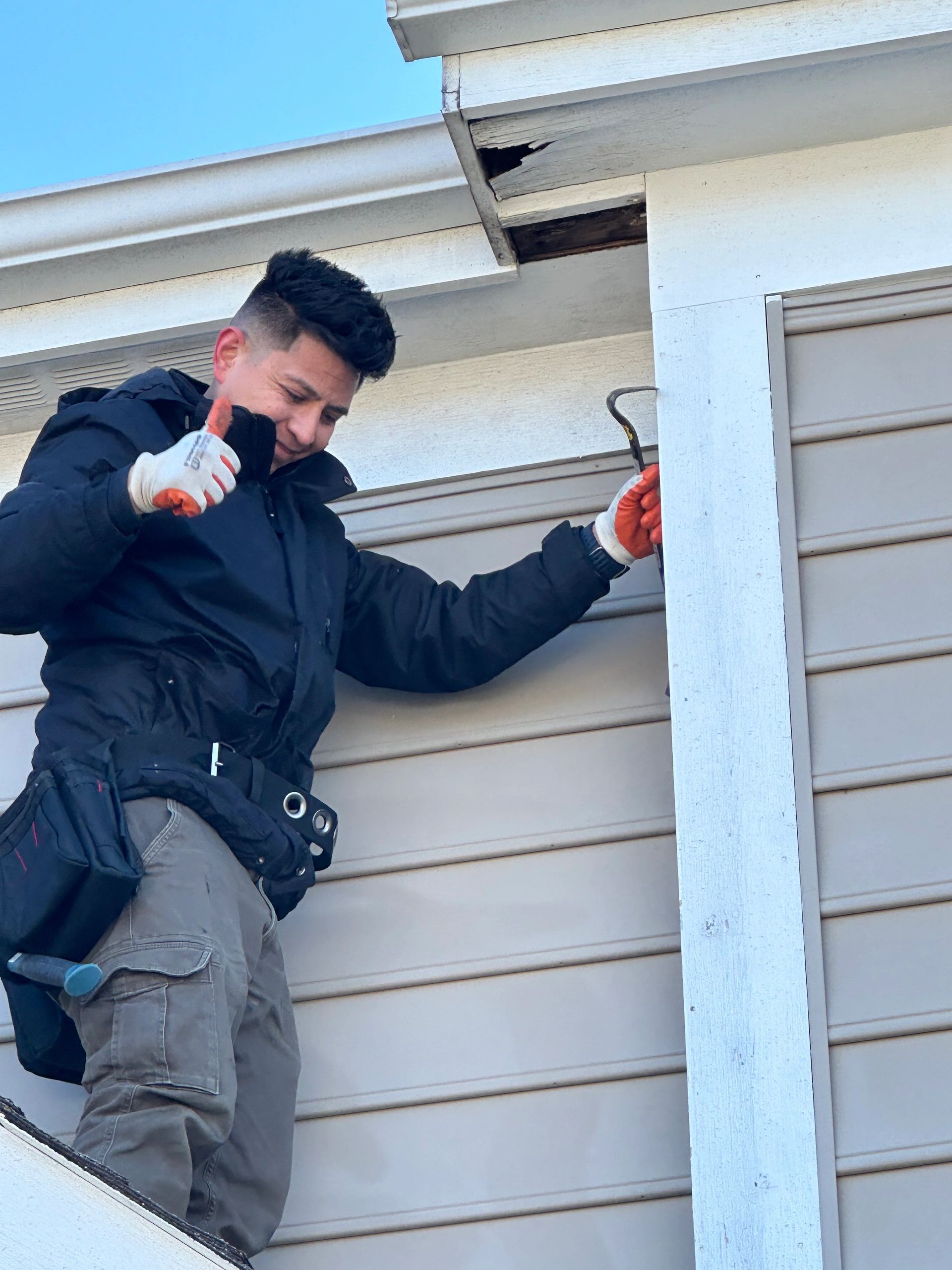 Roofer working on roof
