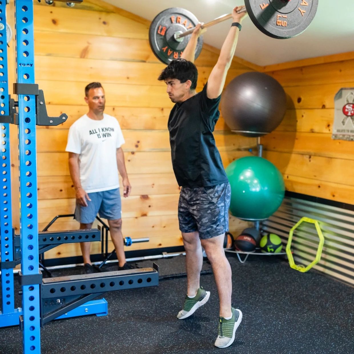 Closeup shot of man lifting the weights