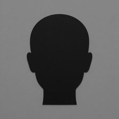 Black silhouette of a human head against a gray background.