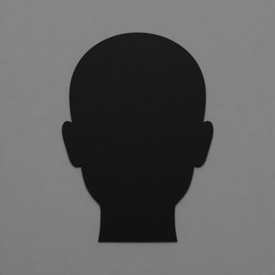 Black silhouette of a human head against a gray background.