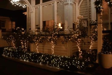 Remuera funeral home illuminated with Christmas fairy and icicle lights.
