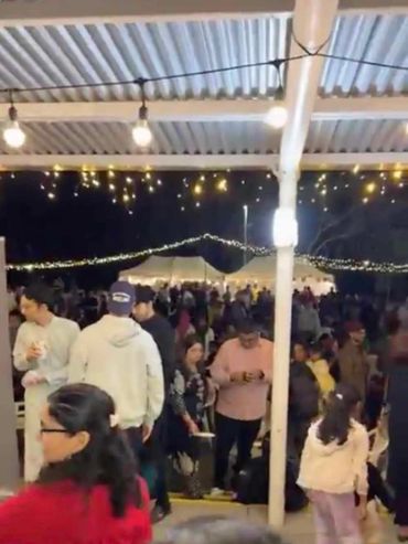 OUTDOOR EVENT LIGHTING and golden moon decoration on stage for community event in Auckland.