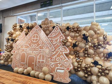 Balloon display featuring Maori design on gingerbread house (collar with artist), Maia Ink.