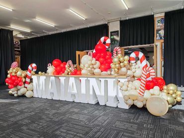 Big balloon garland display fro Christmas charity event at Go Media Stadium with candy canes.