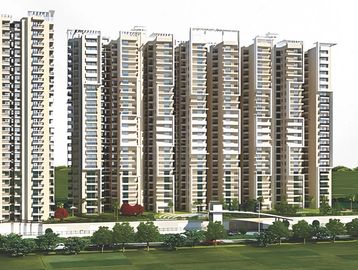 Modern high-rise residential buildings with balconies and green surroundings.