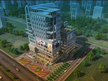 A modern multi-story commercial building surrounded by greenery and roads.