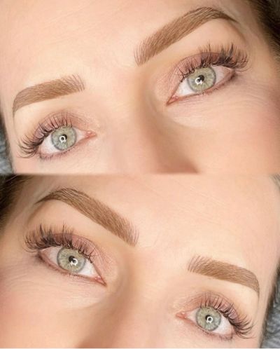 Close-up of eyes with well-groomed eyebrows and long lashes.