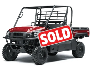 Red and black off-road utility vehicle with rugged tires and protective frame.