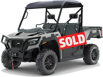 Black and gray off-road utility vehicle with two seats and rugged tires.