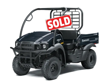 Black Kawasaki utility vehicle with rugged tires and cargo bed.