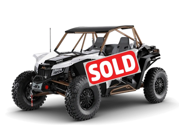 A rugged off-road Wildcat XX vehicle with large tires and a roll cage.