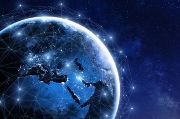 Digital network connections over Earth at night showing Europe and Asia.