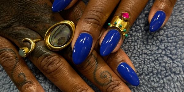 beautiful gelx extension blue nails with unique nail rings. Downtown Los Angeles.