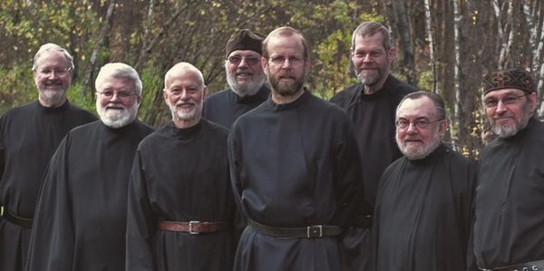 Monks of New Skete with a German Shepherd Dog autumn leaves in background