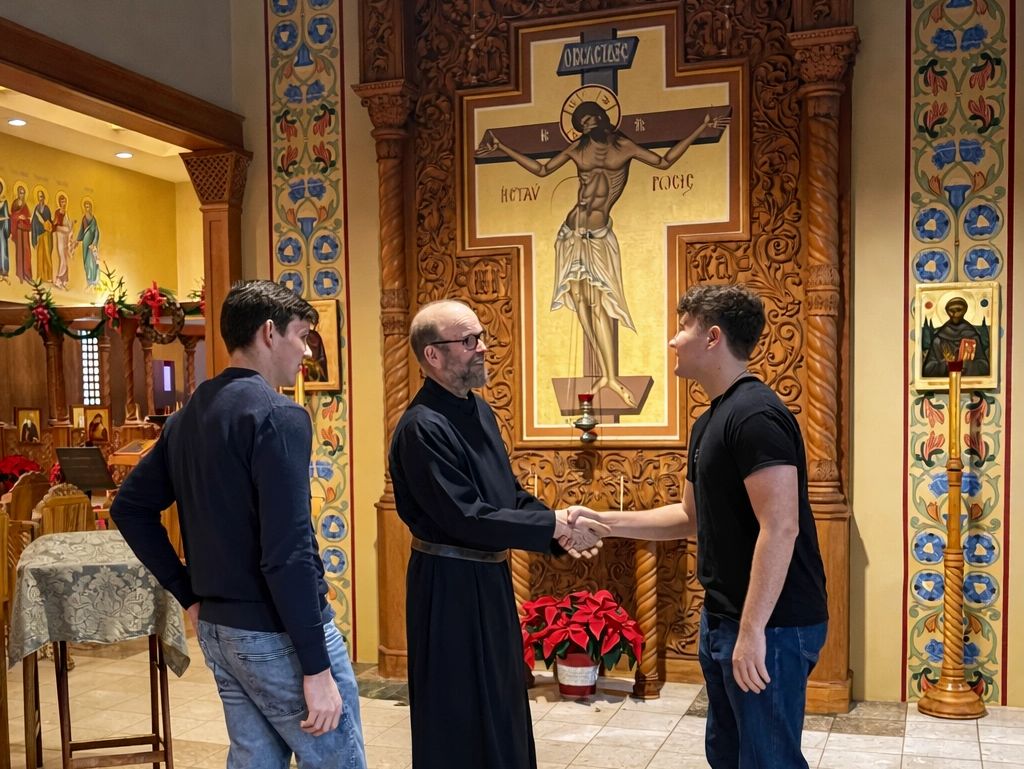 Brother Christopher greeting 2 college students inside the Holy Wisdom Church.
