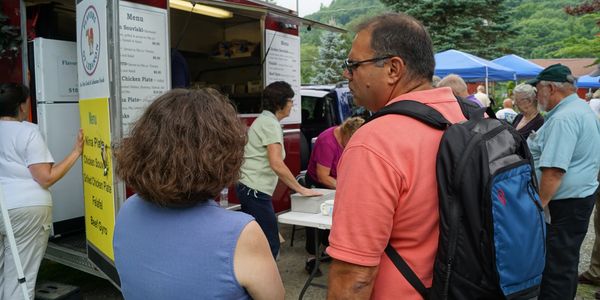 Food truck and customers at the annual Pilgrimage event