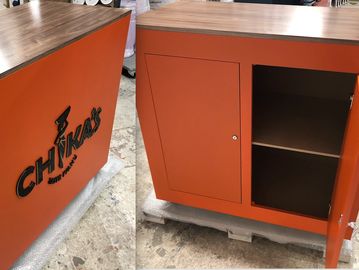 Bespoke cabinet with lockable doors, shelf and base. Walnut veneer top with acrylic logo applied. 