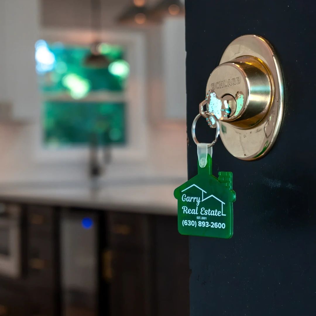 Garry Real Estate house key representing local real estate expertise in Roselle, Illinois.