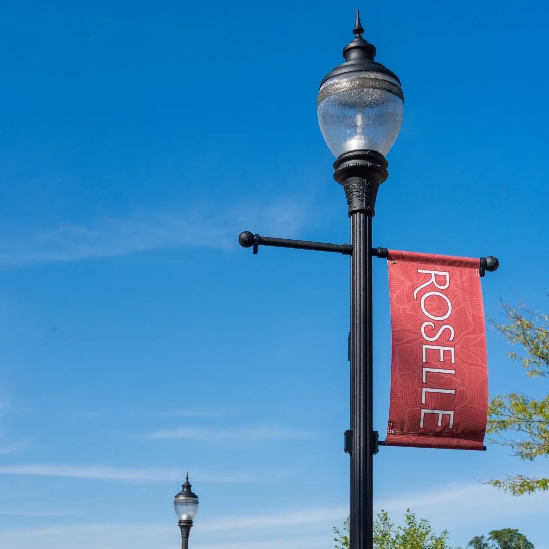 Village of Roselle flag displayed on a downtown light post