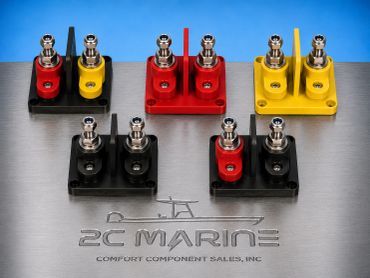 Various color-coded marine electrical connectors on a metal surface.