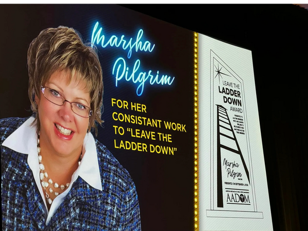 Marsha Pilgrim honored for consistent work on the "Leave the Ladder Down" award.