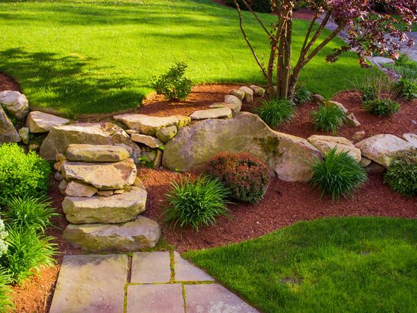 Tropical stone waterfall with greenery