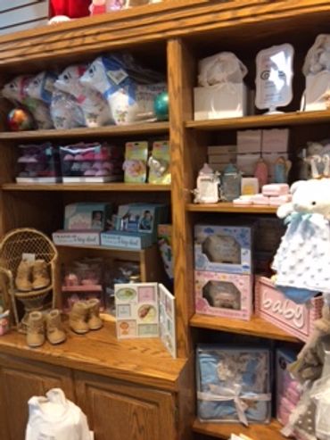 Baby products organized on wooden shelves.