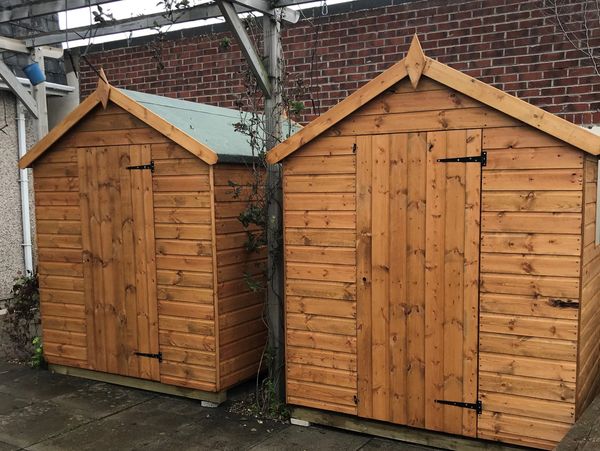 two wooden sheds.